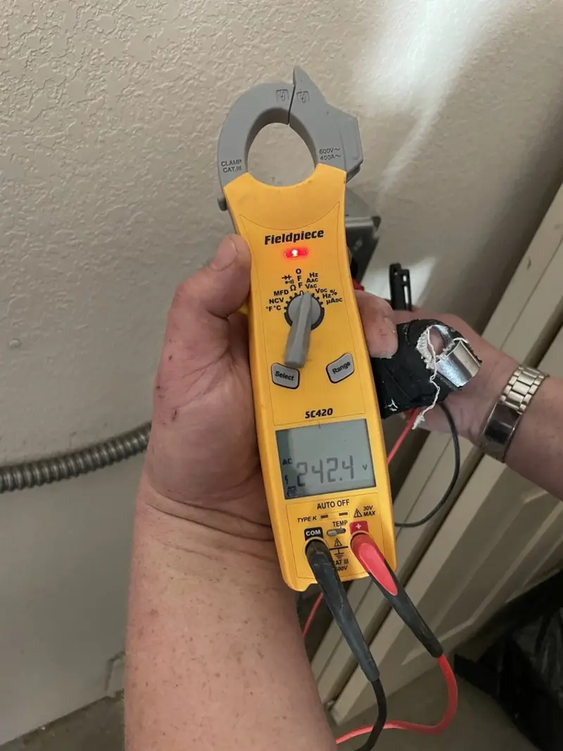 Voltage testing with clamp meter during Generator Installation in Berkshire Lakes